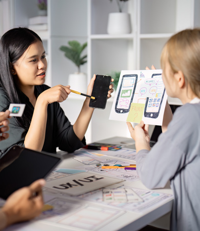 Two females testing a phone